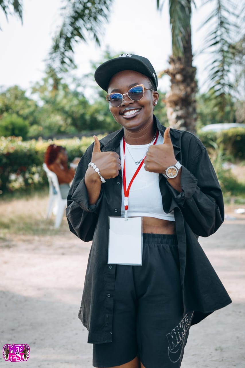 A guest in a blazer wearing a lanyard at MedFest 4